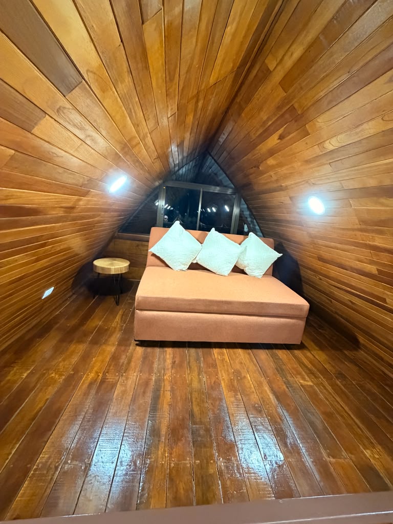 Warm teak wood loft interior of a Guaney bungalow